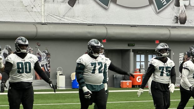 Jordan Davis (90), Linval Joseph (72), and Tarron Jackson (75) get loose prior to practice as Eagles prepared to play the Giants in the divisional round.